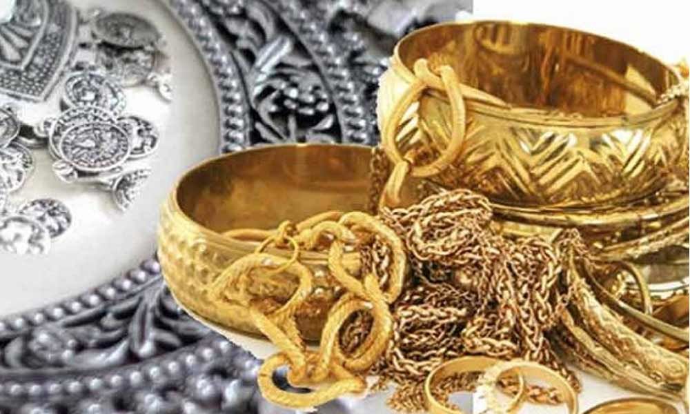 Timbangan jongkong emas dan duit syiling perak melambangkan pembayaran zakat emas dan perak.